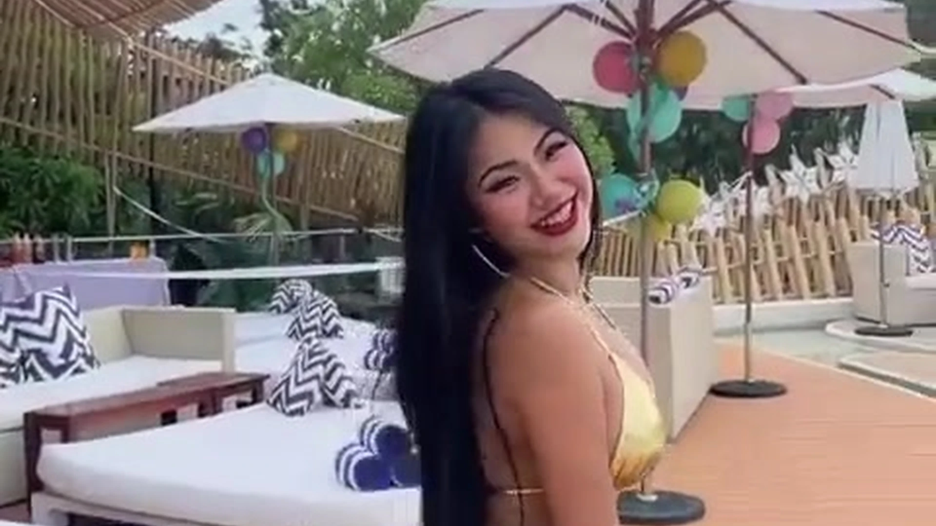 Praewasian in bikini by the hotel pool tease
