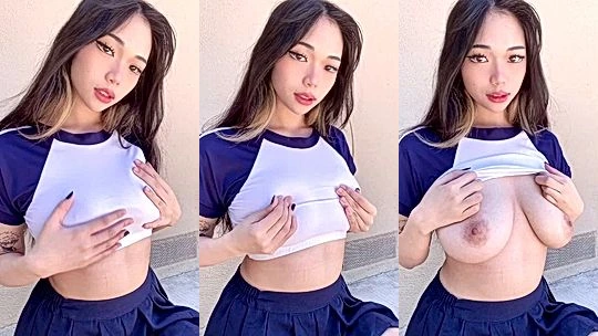 Sexy Asian schoolgirl shows us her big tits