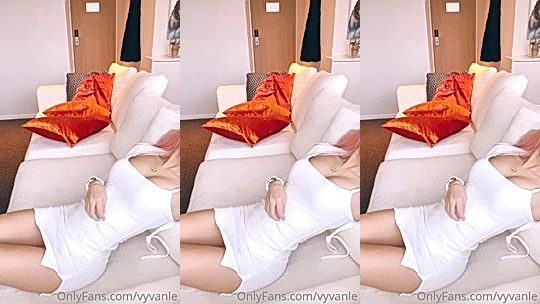 Vyvan Le teasing in her white tight dress on the couch