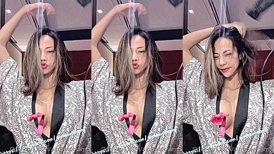 Jiraporn Ngamthuan teasing her perky tits in lingerie and gown