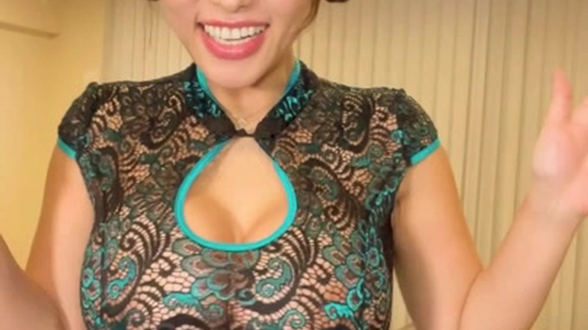 Yuu Sakura teasing her huge tits in her blue cheong sam