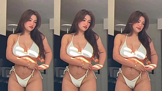 Hot girl Ngan Nguyen teasing her big tits in white bikini