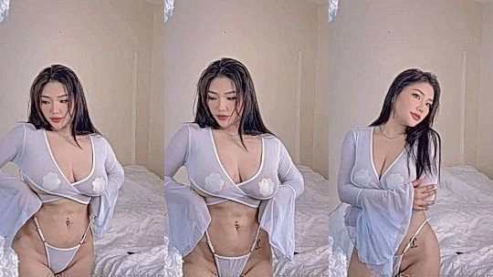 Ngan Nguyen showing off her huge tits in white see-through gown